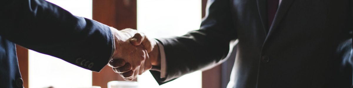 Business people shaking hands in a meeting room